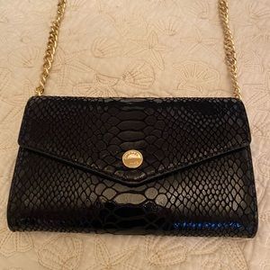 Micheal Kors black crossbody bag w gold chain.